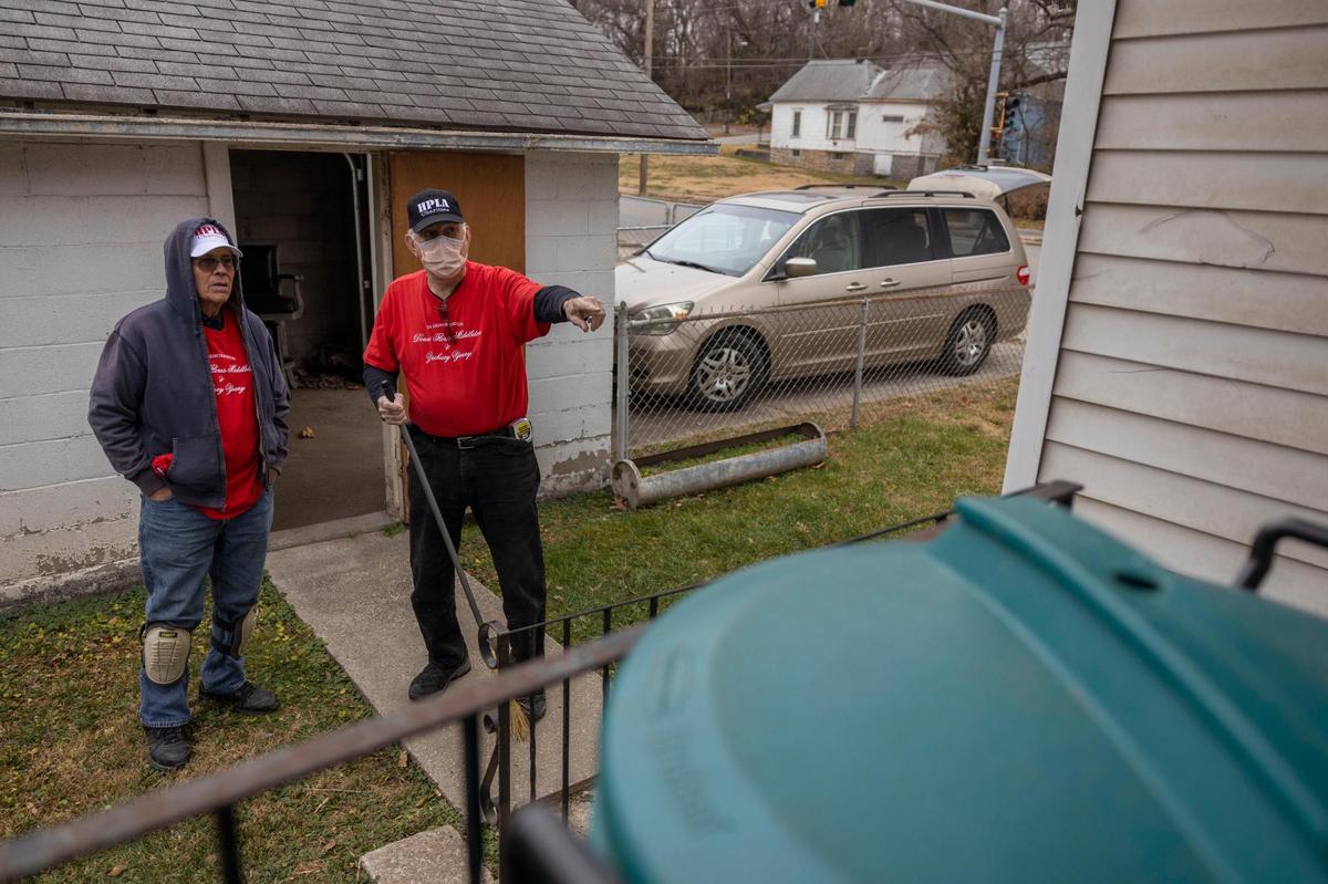Volunteer Fran Arnett, left, and Robert Flores, Chairman of Habitaciones Para Latinos Association (HPLA), help a resident with repairs to a back deck on Dec. 17 in Kansas City, Kansas. In 2021, Americans spent an average of $10,341 on home improvement, according to Angi’s 2021 State of Home Spending Report. That’s a 25% increase from 2020.