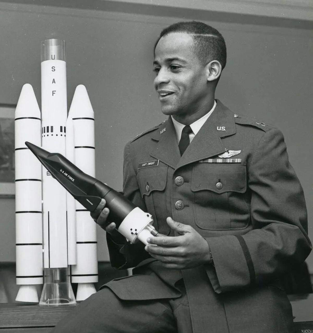 Astronaut candidate Capt. Ed. Dwight Jr. posed with a model of a spacecraft in November 1963, days before President John F. Kennedy was assassinated. Dwight considered Kennedy his sponsor in the space program. Upon his death, Dwight said, authorities wanted him to die, too.