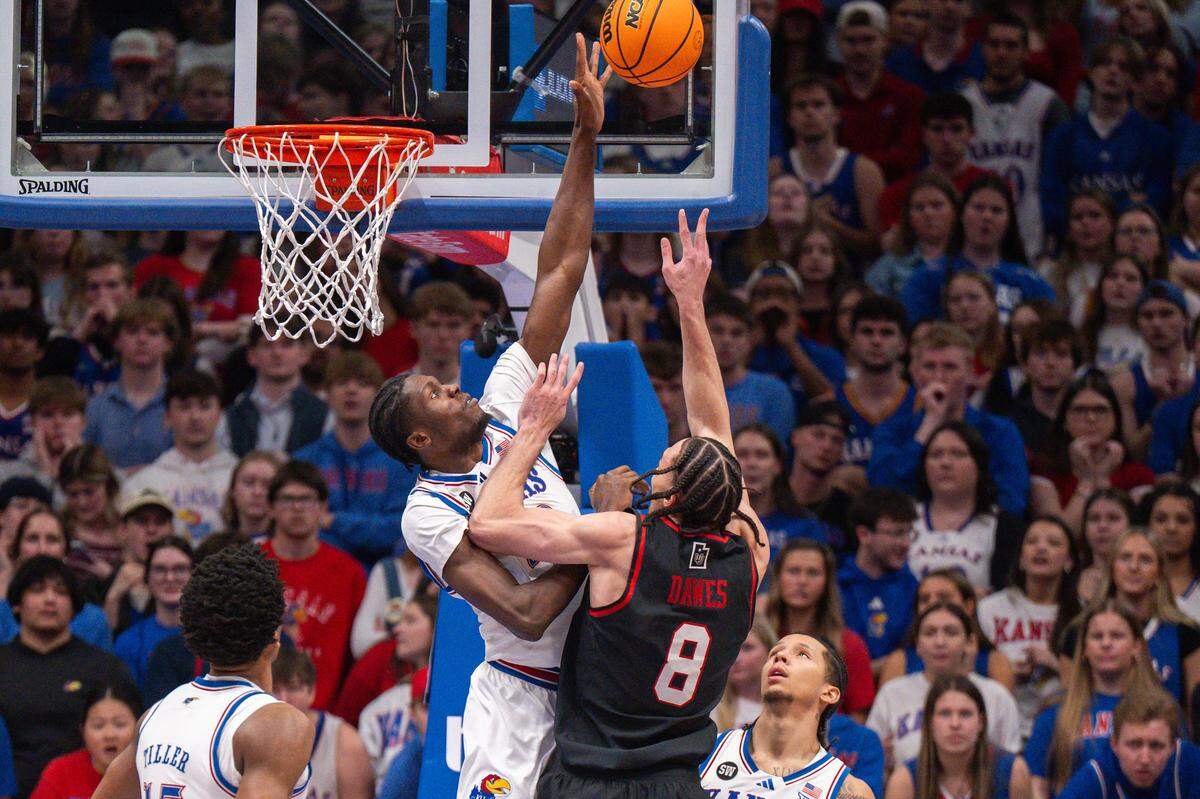 Kansas Jayhawks big man Flory Bidunga (40) blocks a shot from Utah Utes forward Keanu Dawes (8) in the first half on Saturday, February 7, 2026, at Allen Fieldhouse.