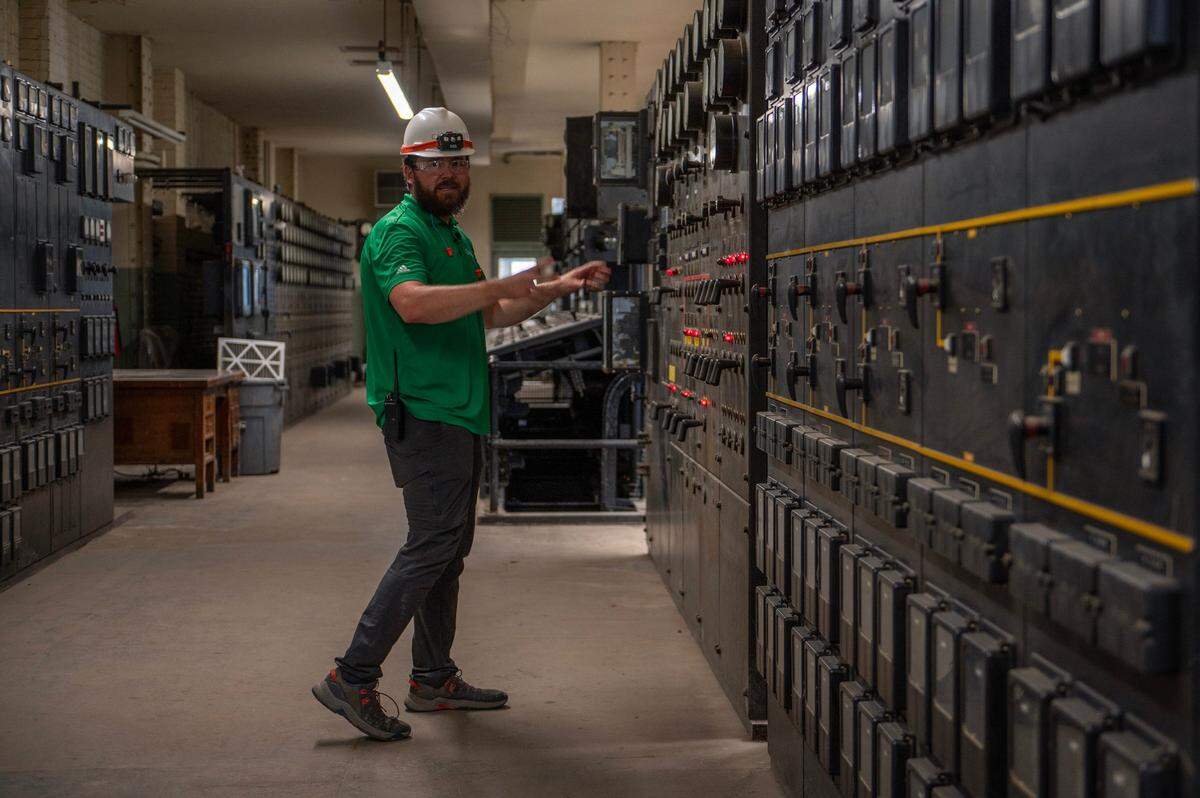 Josh Jeffus, plant manager, shows some of the old school control instruments used in one of the older control rooms at the Vicinity Energy plant.