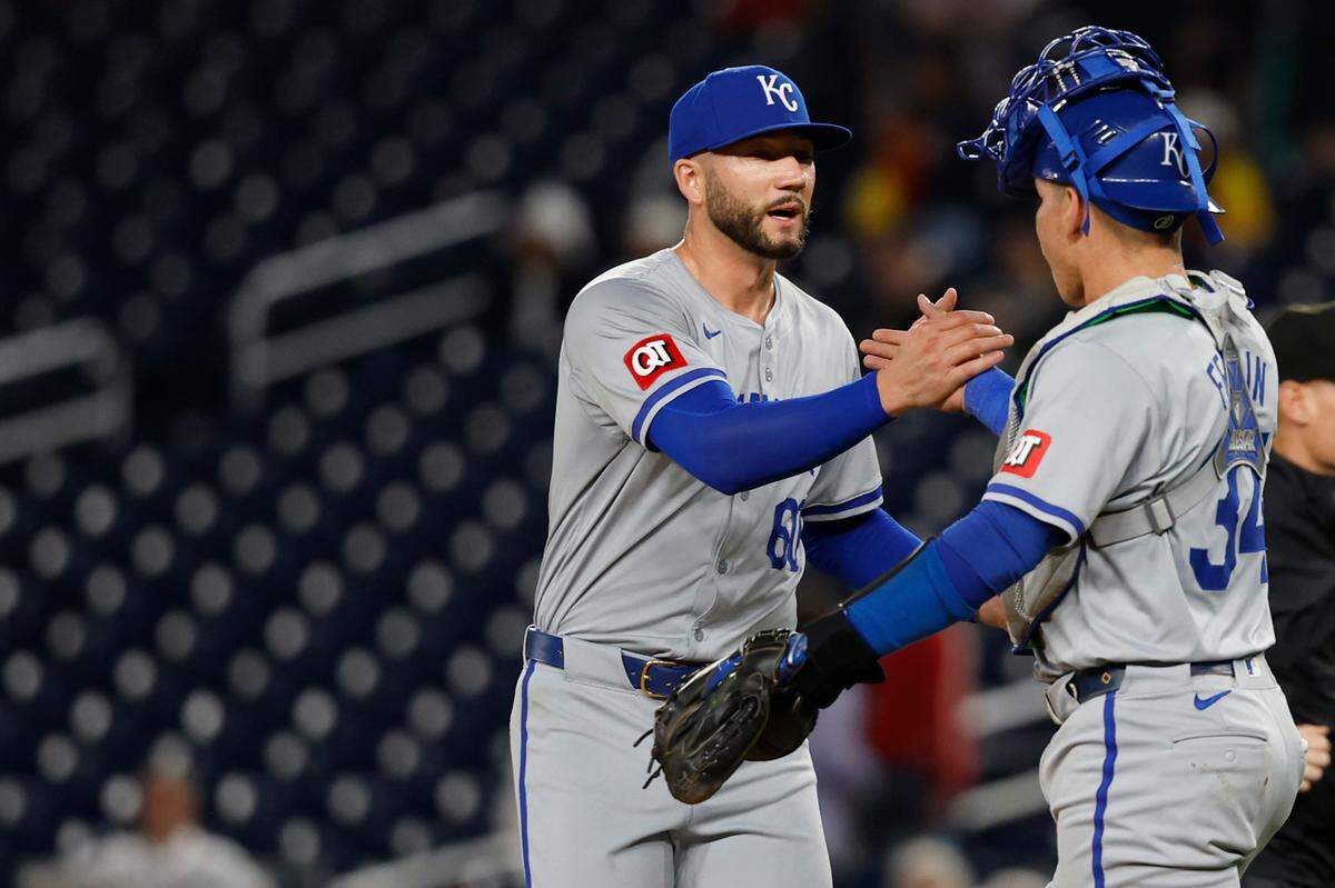 Kansas City Royals pitcher Lucas Erceg (60) celebrates with catcher Freddy Fermin (34) after the final out against the Washington Nationals at Nationals Park on Sept. 25, 2024.