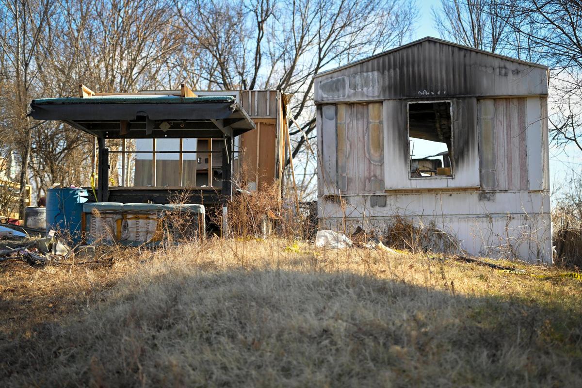 Two burned-out mobile homes sit among debris in Blue Summit, an unincorporated community between Kansas City and Independence in Jackson County.