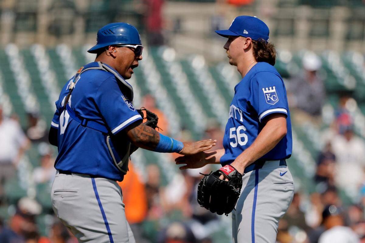 Kansas City Royals catcher Salvador Perez (13) and pitcher Hunter Harvey (56) celebrate after defeating the Detroit Tigers at Comerica Park on Aug. 4, 2024.