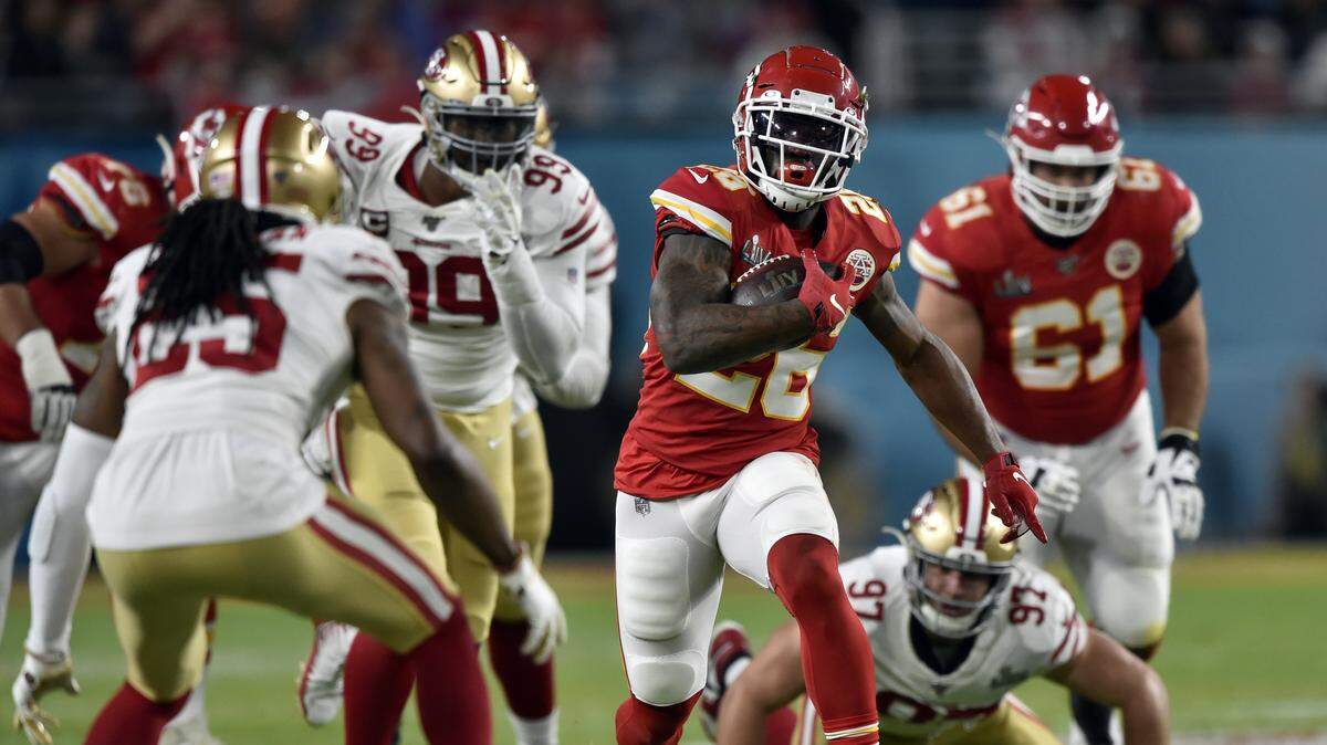 Kansas City Chiefs running back Damien Williams (26) breaks free for a big gain in the first quarter of Super Bowl 54. Kansas City Chiefs vs. San Francisco 49ers. Super Bowl 54, Hard Rock Stadium, Miami Gardens, FL. February 2, 2020.
