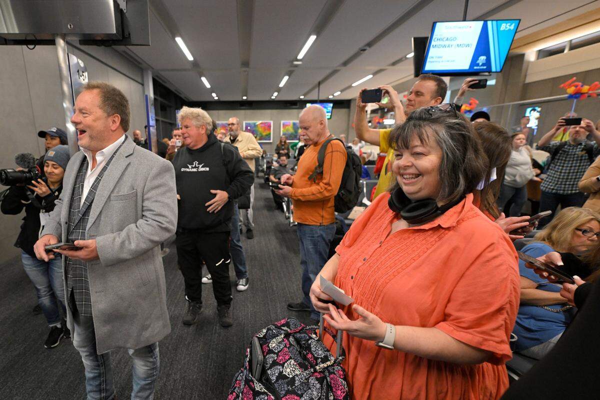 Travelers cheered as boarding began for the first flight, a Southwest Airlines flight, from the new $1.5 billion single terminal at Kansas City International Airport opened to travelers Tuesday, Feb. 28, 2023.