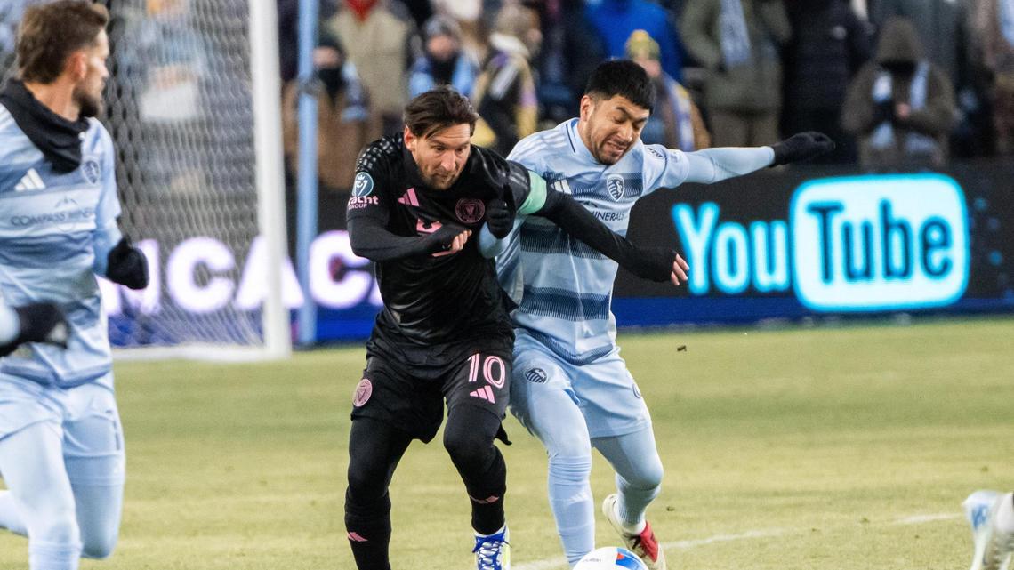 Inter Miami forward Lionel Messi tackles the ball away from Sporting KC’s Memo Rodriguez in the first half of the Concacaf Champions Cup match on Wednesday, Feb. 19, 2025, at Sporting Park. Messi scored the lone goal of the match.