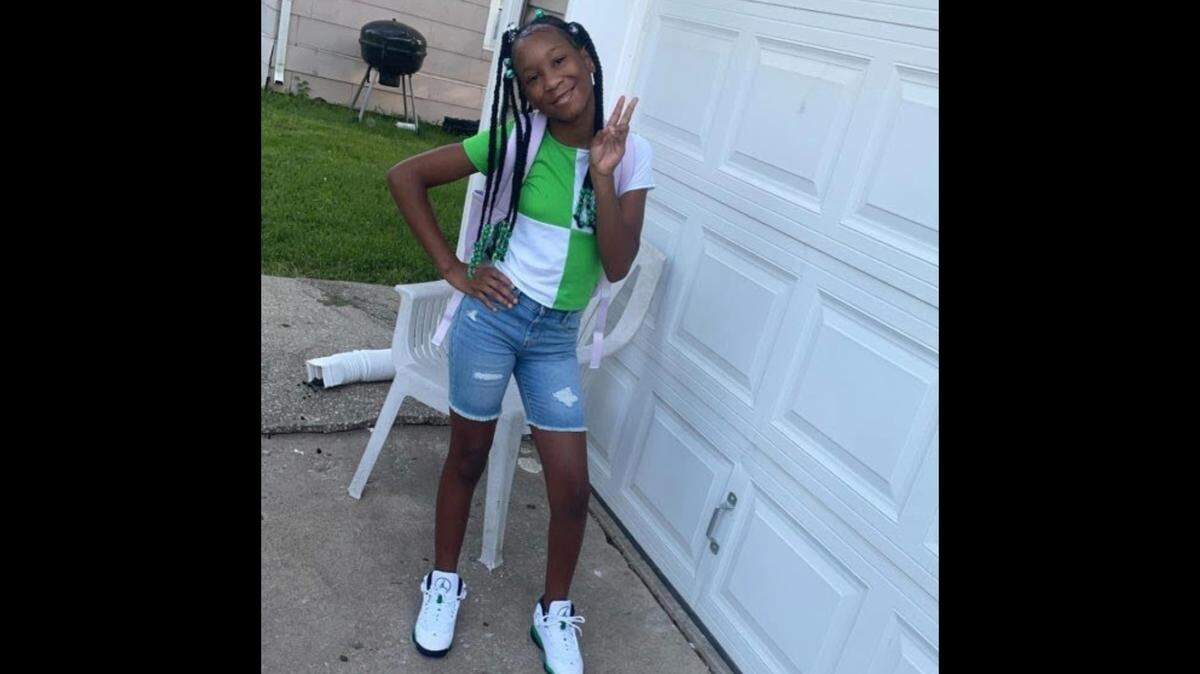 Lauren Reddick, 11, poses for a picture holding up a peace sign, in a photo taken before she was paralyzed by a stray bullet in her Kansas City bedroom on Nov. 1, 2023.