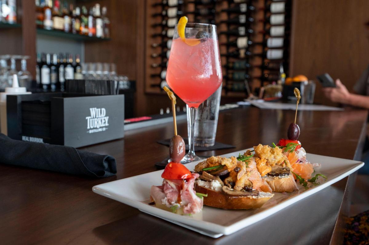 Charcuterie bites contain prosciutto, balsamic glaze, salmon, cucumber, mushroom and fried shallots at Roots Seasonal Cuisine.