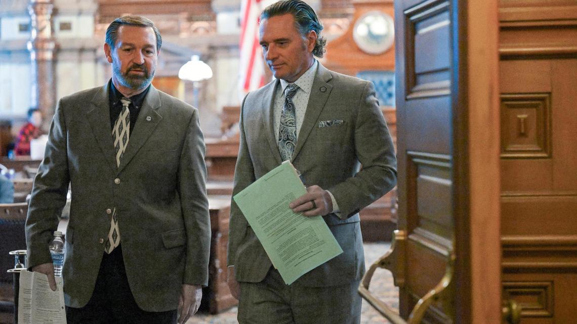 Senator Virgil Peck, left, and Kansas Senate President Ty Masterson leave the Senate chamber after session on Tuesday, March 14, 2023, in Topeka, Kansas.