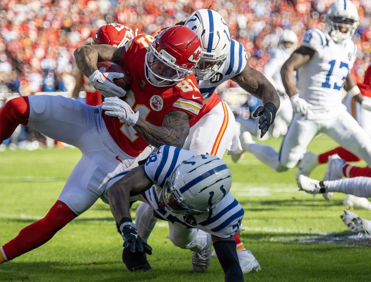 Kansas City Chiefs wide receiver Nikko Remigio (81) is tackled on a kick off run by Indianapolis Colts cornerback Chris Lammons (38) in the first half on Sunday, Nov. 23, 2025 at GEHA Field at Arrowhead Stadium in Kansas City.