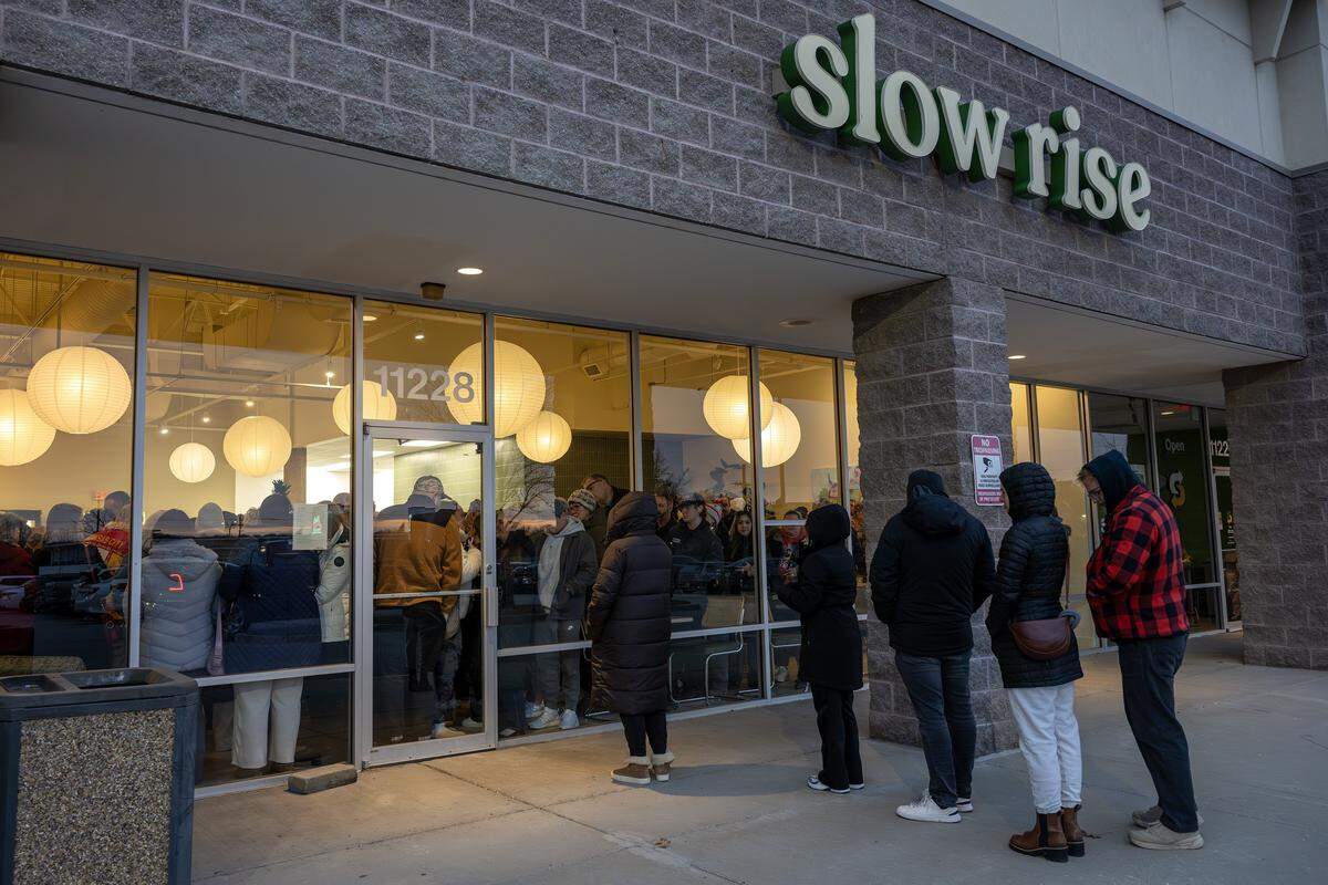 Visitors pack inside Slow Rise while waiting in line during the shop's soft opening on Friday, Jan. 23, 2026, in Overland Park.