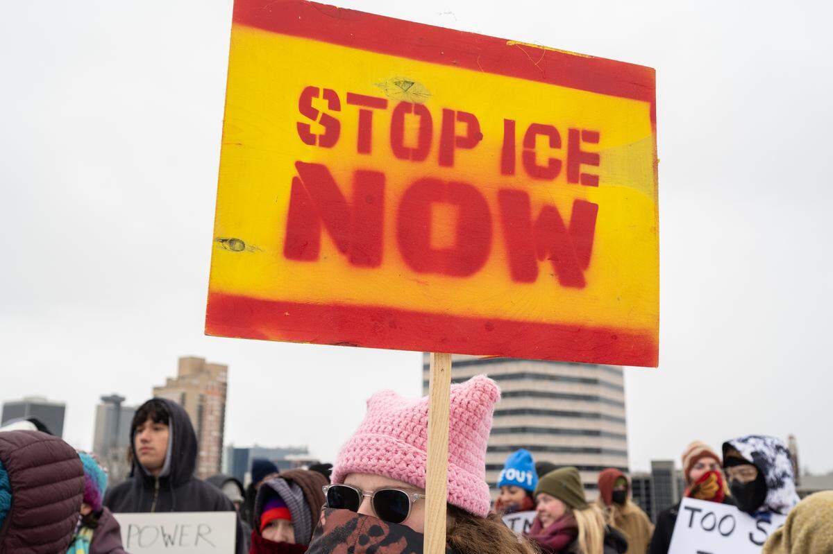 Protesters gathered at the World War I Museum and Memorial to rally against recent ICE actions across the U.S. and in Kansas City on Friday, Jan. 30.