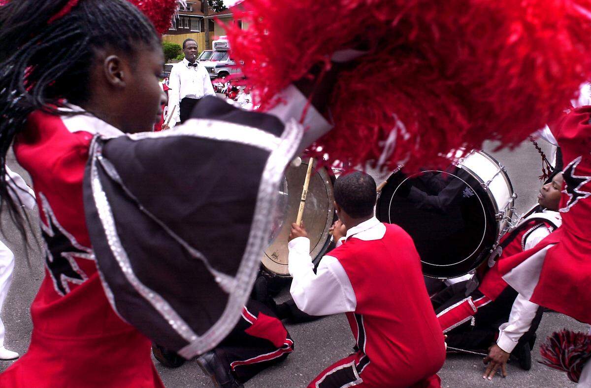 Members of the Marching Cobras gave a rousing and energetic performance in 2003 for the First Annual Marching Cobras Day.