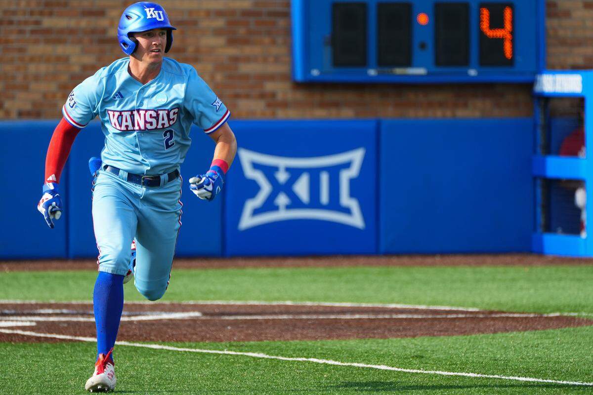 Jayhawks infielder Tyson LeBlanc (2) runs toward first base in the third inning during an NCAA baseball tournament game against the Arkansas Razorbacks at Hoglund Ballpark on Sunday, May 31, 2026, in Lawrence.