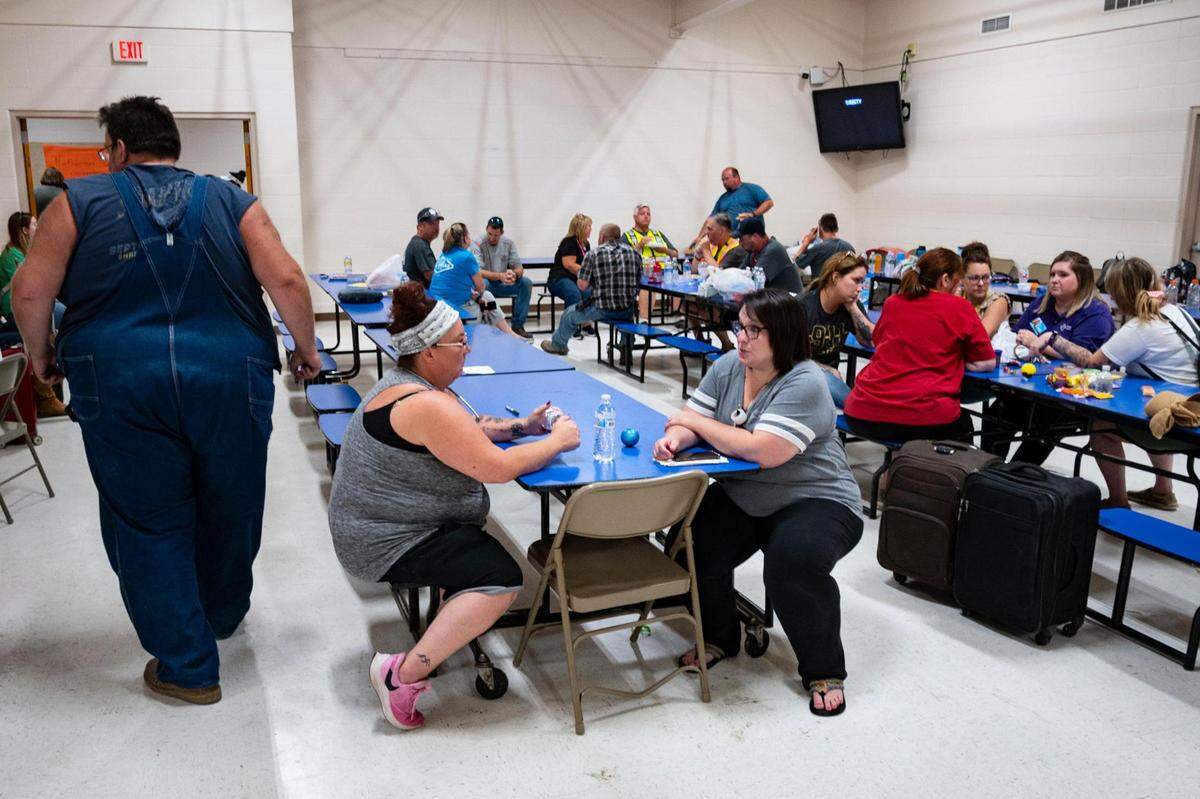 Passengers of an Amtrak train that crashed into a truck near Mendon, Missouri, Monday gather in the gymnasium at Northwestern R-1 School.