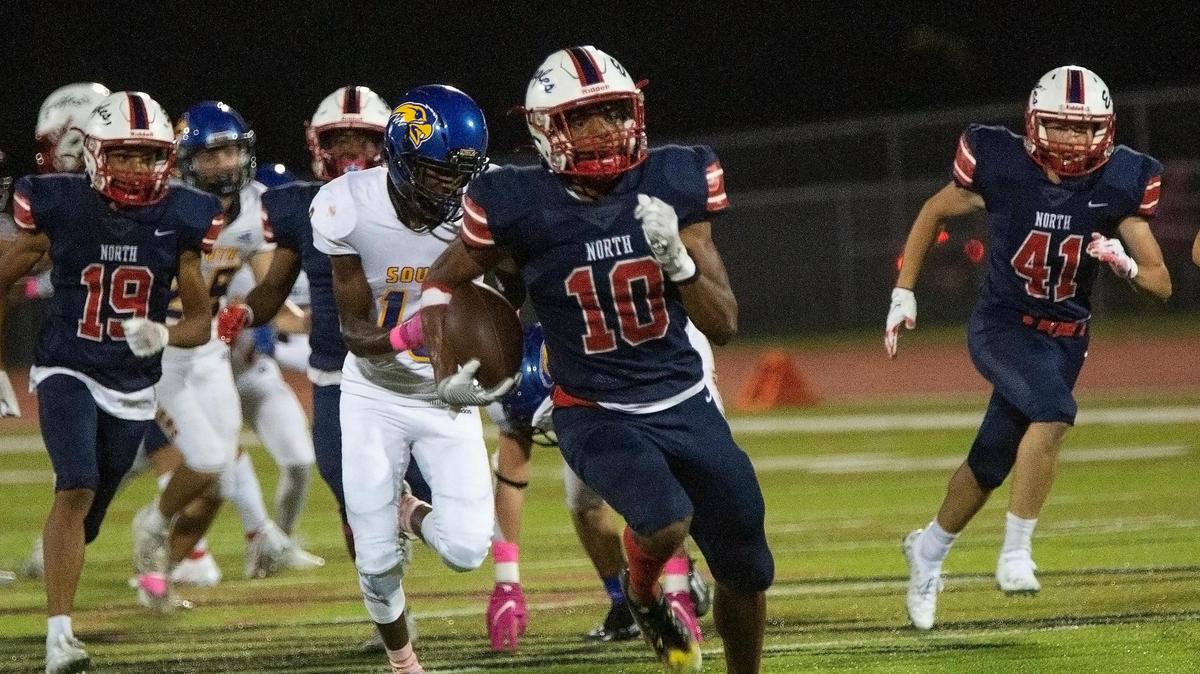 Jacob Parrish, # 10 of Olathe North headed to the end zone in the second quarter of the game against Olathe South Friday, October 21, 2021 at the Olathe District Athletic Complex. Olathe North was ahead 30 to 6 at the end of the first half.