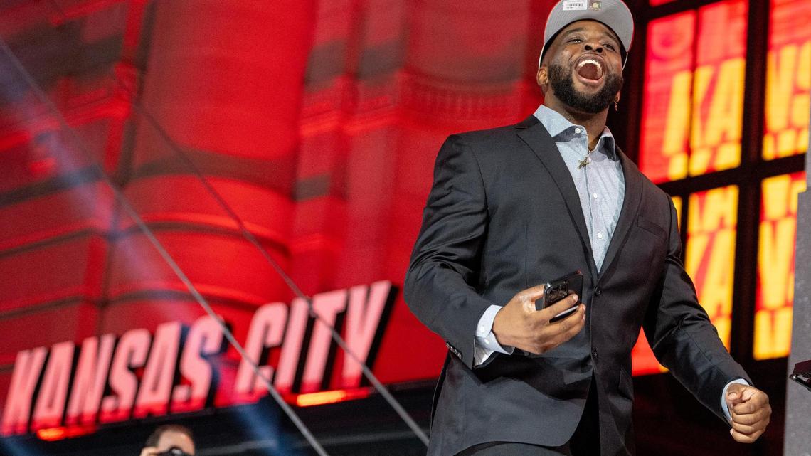 Kansas State defensive end Felix Anudike-Uzomah walks on stage during the second round of the NFL Draft outside of Union Station on Friday, April 28, 2023, in Kansas City. Anudike-Uzomah was selected 31st overall by the Kansas City Chiefs.
