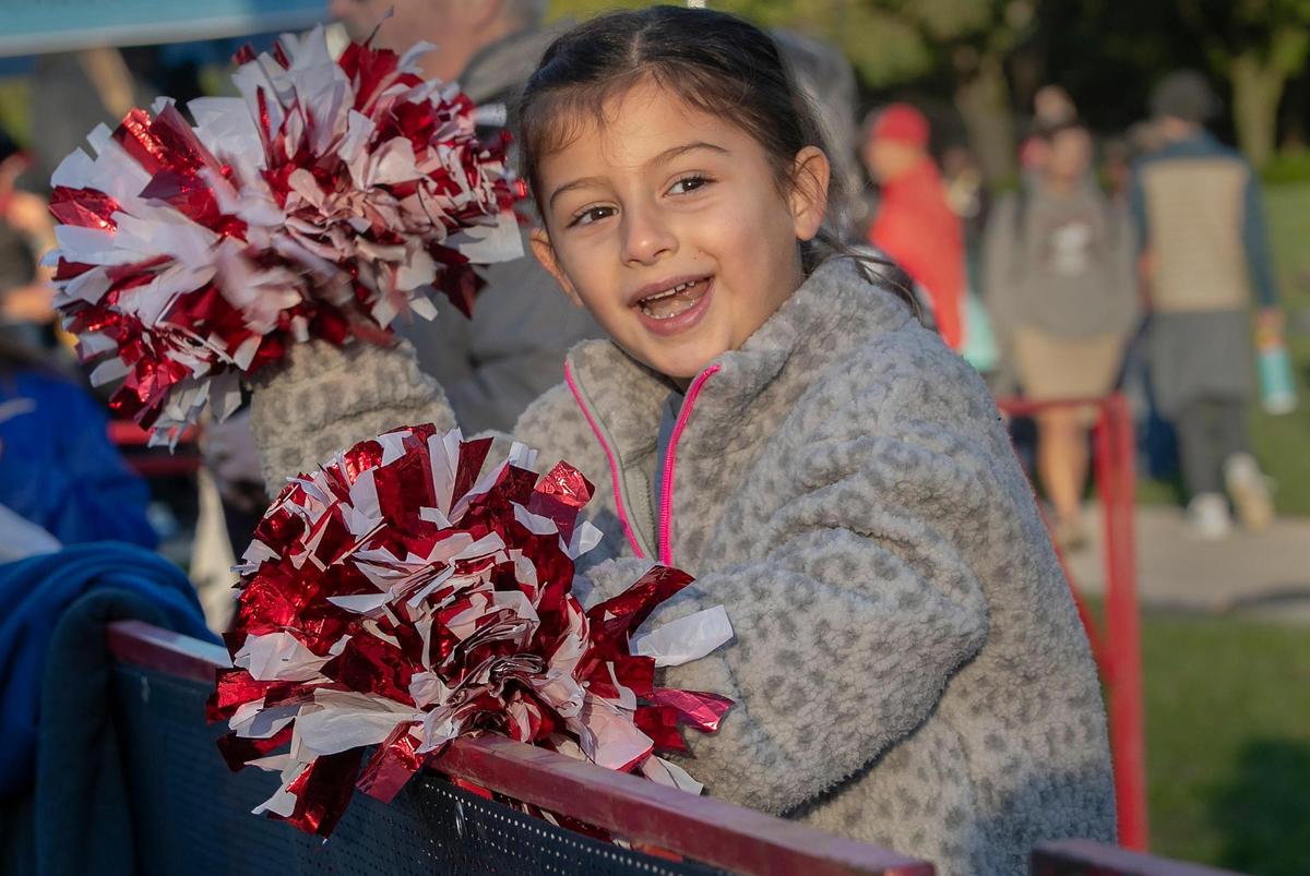 Five-year-old Romy Sarani of Prairie Village cheered on her dad, Nima Sarani, during the 10K at the 2024 Garmin Kansas City Marathon on Saturday, October 19, 2024 in KC.