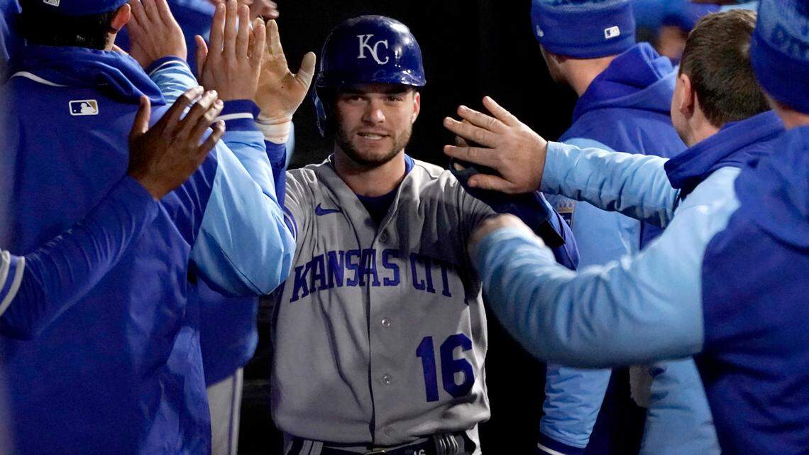 Kansas City Royals’ Andrew Benintendi is greeted in the dugout after scoring on Carlos Santana’s two-run single during the sixth inning of the team’s baseball game against the Chicago White Sox on Tuesday, April 26, 2022, in Chicago. (AP Photo/Charles Rex Arbogast)