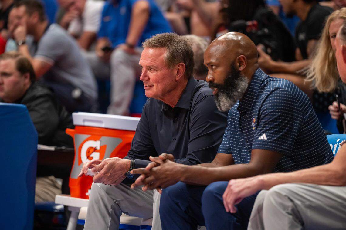 Kansas Jayhawks head coach Bill Self and assistant coach Jacque Vaughn talk on the bench prior to the men's scrimmage at Late Night in the Phog, on Friday, October 17, 2025, in Lawrence.