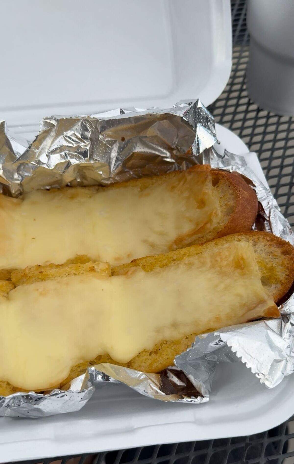 The cheesy garlic is served at Imo’s Pizza, a chain known for its St. Louis-style pizza.