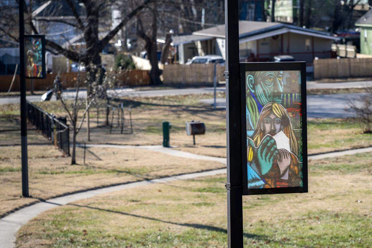 A public art panel stands along a walkway at Lykins Square Park on Tuesday, Dec. 16, 2025, in Kansas City.