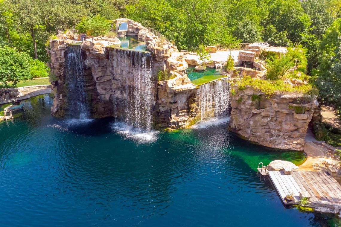 Waterfall and pond on a Lake Quivira mega mansion at 5225 Renner Rd., which will be auctioned off with no reserve by Concierge Auctions. Bids accepted July 23 through July 28.