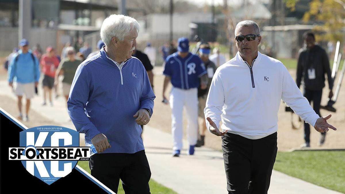 Kansas City Royals owner John Sherman, left, and general manager Dayton Moore walk between practice fields during spring training baseball practice Monday, Feb. 17, 2020, in Surprise, Ariz. (AP Photo/Charlie Riedel)
