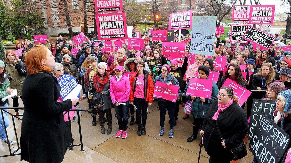 Rev. Molly Housh Gordon of the Unitarian Universalist Church in Columbia, left, spoke to a crowd in front of Jesse Hall on the campus of the University of Missouri-Columbia on Nov. 30, 2015. The group called for the University of Missouri to reinstate contracts with Planned Parenthood of Kansas and Mid-Missouri.