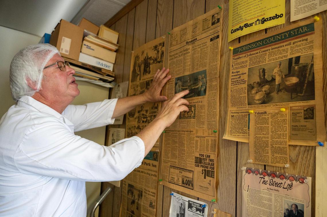 Longtime plant manager Dave Swiercinsky, 60, carefully looks over vintage newspaper articles on the wall In the office at the Sifers Valomilk plant in Merriam. He has been employed at the plant since he was 22 years old.