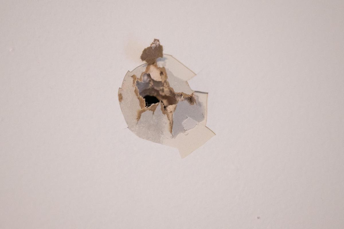 A bullet hole in the second floor of Roger Keyes’ north Hyde Park home.