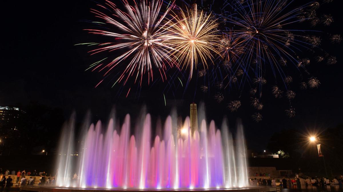 Fireworks burst over the tower at the National WWI Museum and Memorial and the Henry Wollman Bloch Fountain Thursday, July 4, 2024, in Kansas City.
