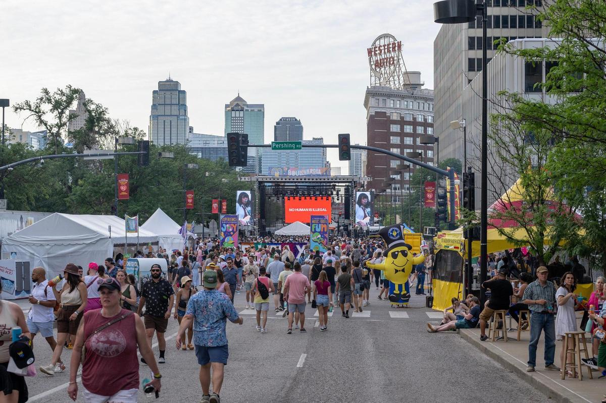 People walk along Grand Boulevard during Boulevardia on Saturday, in Kansas City. It was the festival’s 10th year.