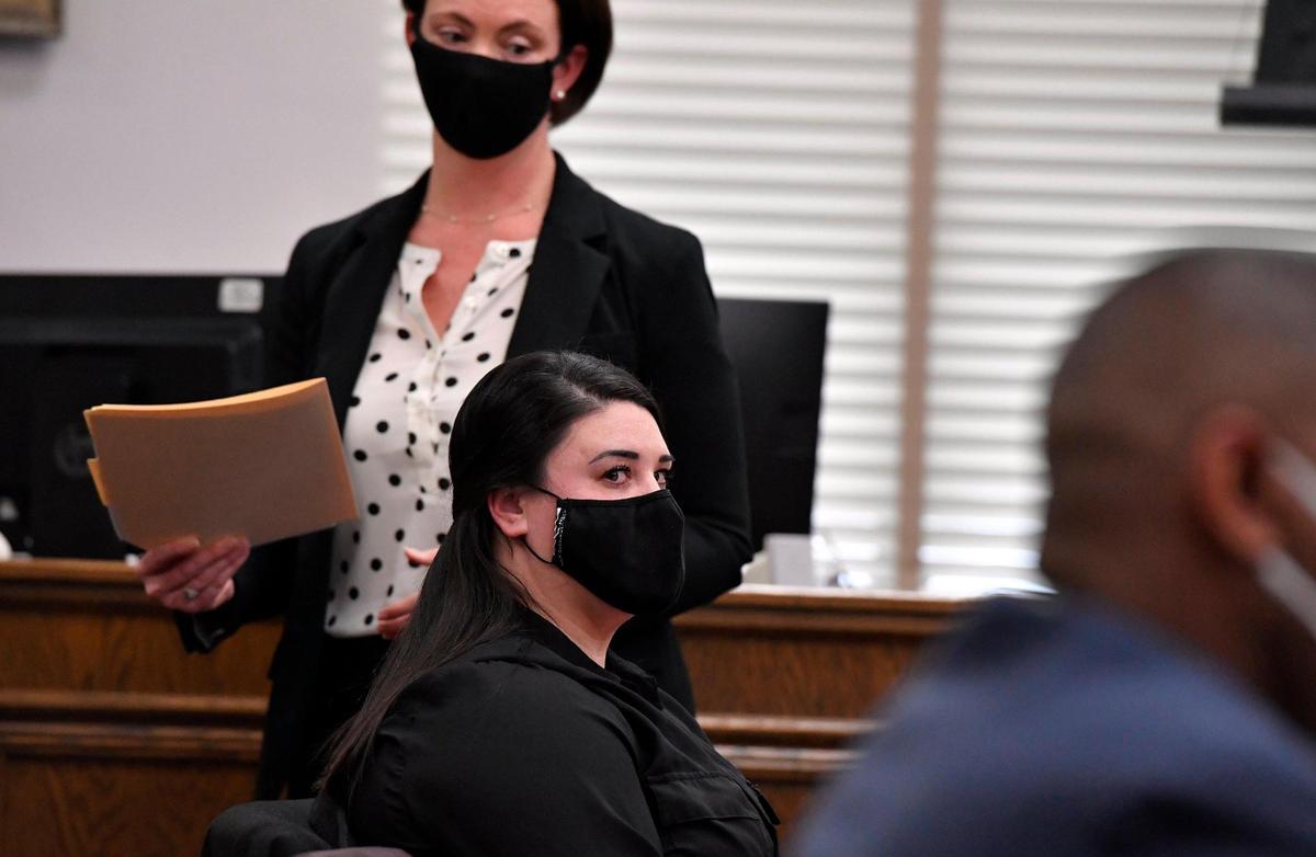Lauren N. Michael, seated, a former Jackson County sheriff’s deputy who shot a woman in the back in 2019 was sentenced to 180 days in jail. Michael appeared Thursday before Jackson County Circuit Court Judge Patrick Campbell. In January, Michael pleaded guilty to first-degree assault. The plea agreement called for a minimum of 120 days shock time in custody with three years probation and a six year suspended prison sentence.