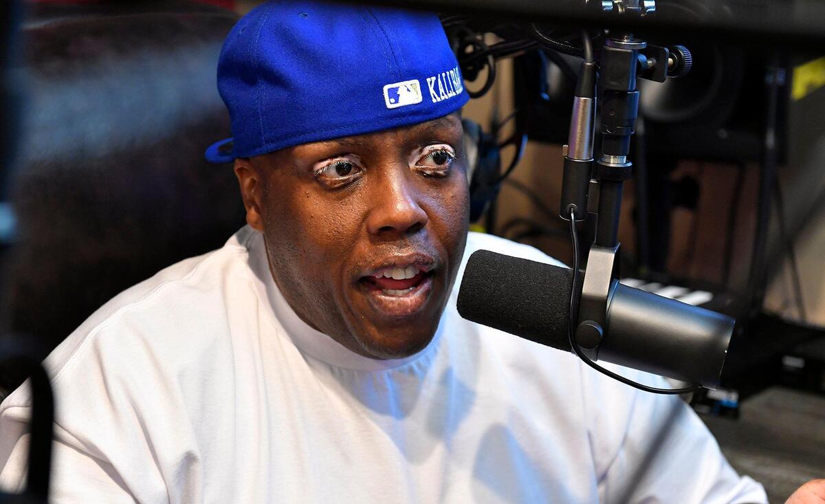 Music artist Krizz Kaliko sits in home studio where he records his music, livestreams and does voice acting work.