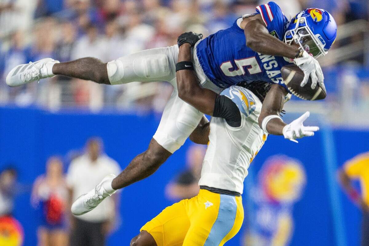 Kansas Jayhawks wide receiver Nik McMillan (5) makes an acrobatic catch in the second half of the Jayhawks game vs. Long Island University Sharks at David Booth Memorial Stadium on Friday, September 4, 2026, in Lawrence.