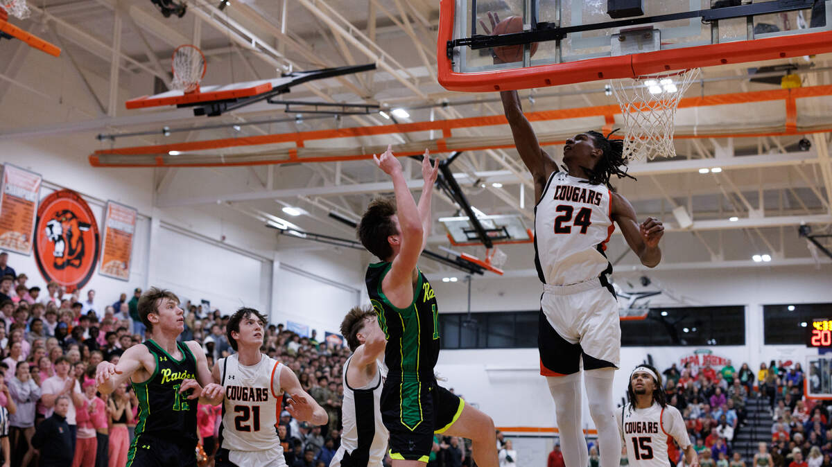 Ethan Taylor blocks a shot during Shawnee Mission Northwest’s 79-68 win on Friday, Feb. 7, 2025.
