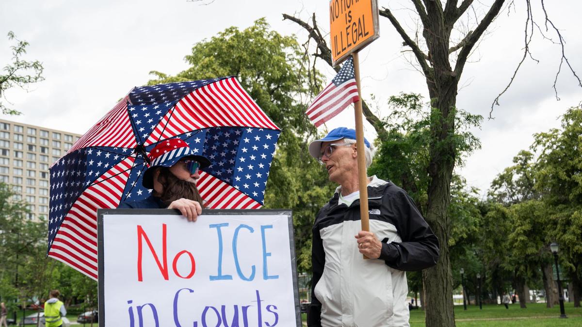Around 50 protesters gathered outside a federal immigration courthouse in downtown Kansas City on Tuesday, May 27, 2025. People held signs and chanted against Immigration and Customs Enforcement targeting undocumented people appearing in court.