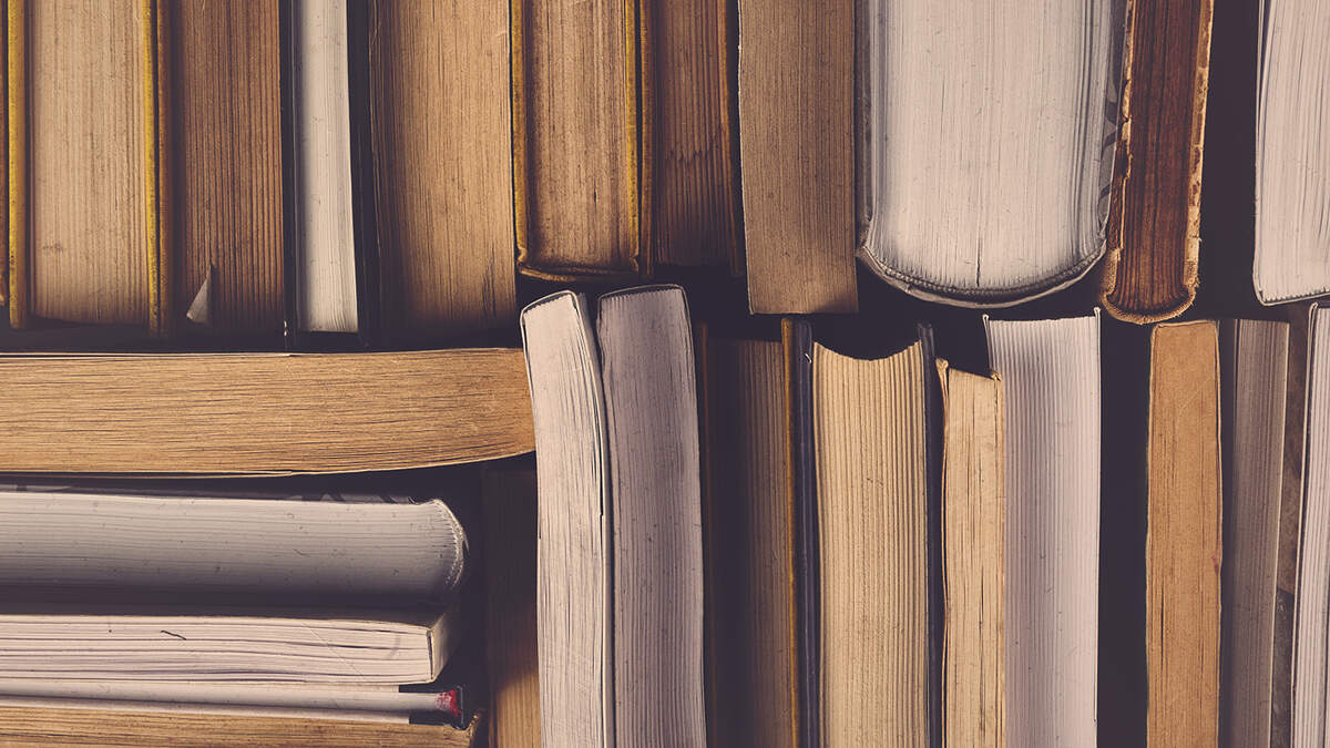 Stack of Used Old Books in the School Library, Toned Cross Processed Image. Getty Images | Royalty Free