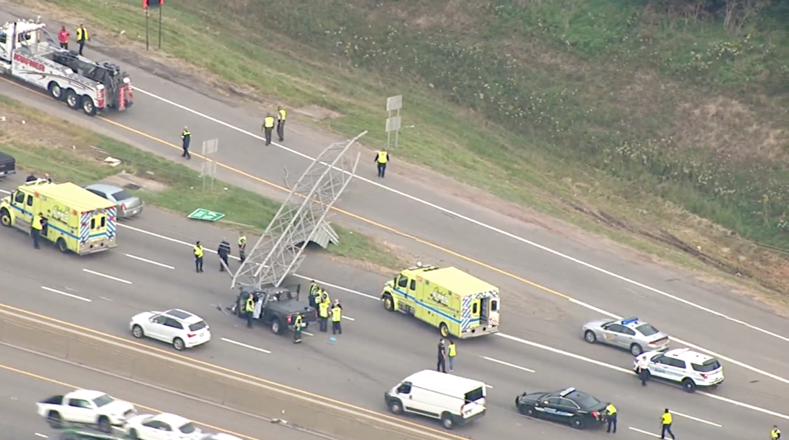 Officials in Ohio say a highway sign fell and crushed a pickup truck, kiling the driver.