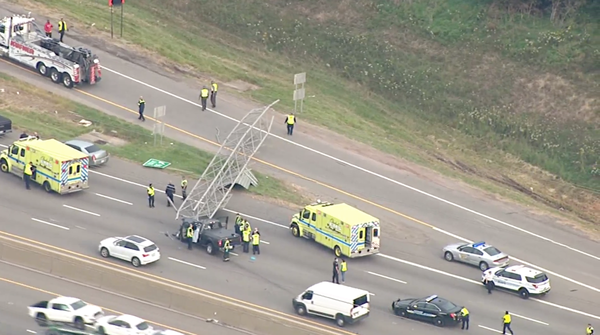 Officials in Ohio say a highway sign fell and crushed a pickup truck, kiling the driver.