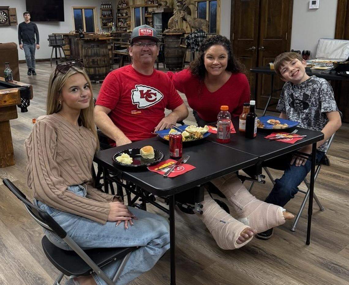Dan Foil, Stilwell’s social media-famous dancing cowboy, with his family at Thanksgiving after he was injured in a fall from his roof on Nov. 20.