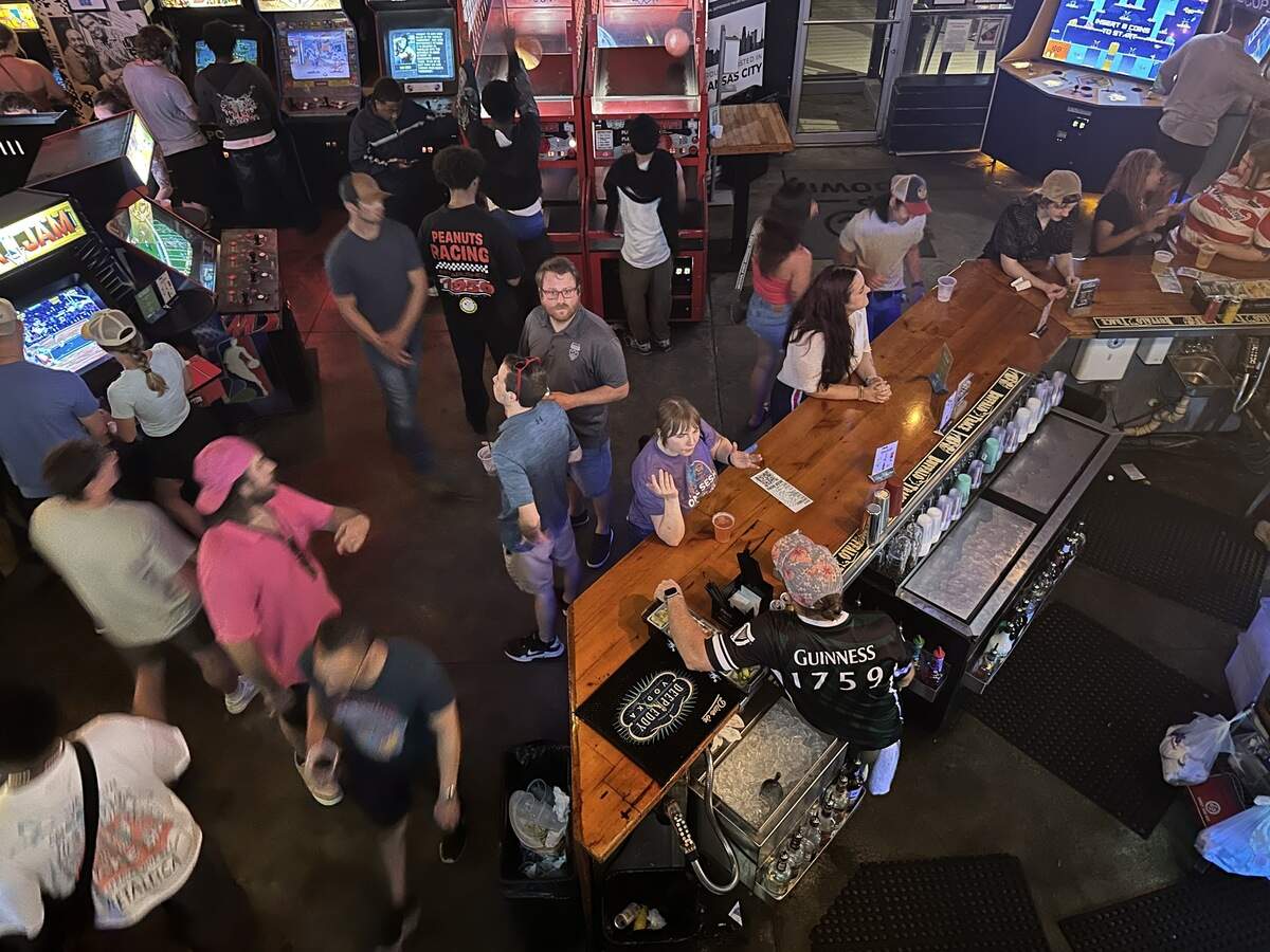 Customers are seen ordering drinks and playing various games at Up-Down on Saturday, June 27. Up-Down is one of a few bars that were allowed to extend hours until 5 a.m. during the World Cup.