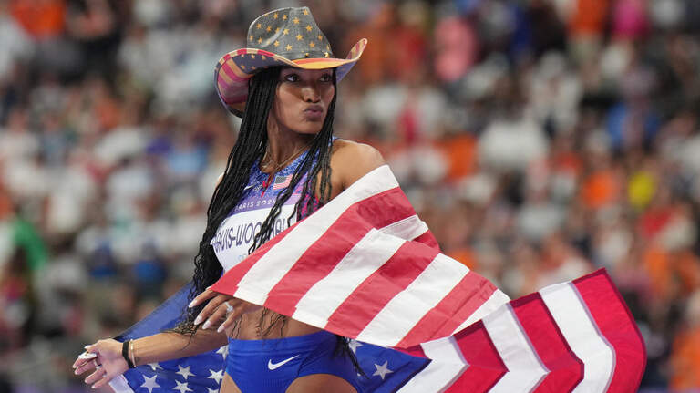 Newly hired Kansas State track coach takes Olympic gold in long jump for Team USA