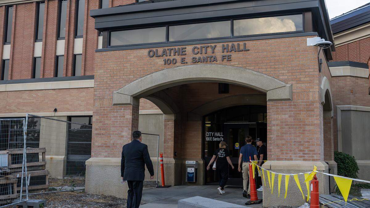 People arrive at Olathe City Hall for the Olathe City Council meeting on Tuesday, Sept. 16, 2025. The council discussed a proposal for a Lineage Cold Storage facility near 175th Street and Lone Elm Road.