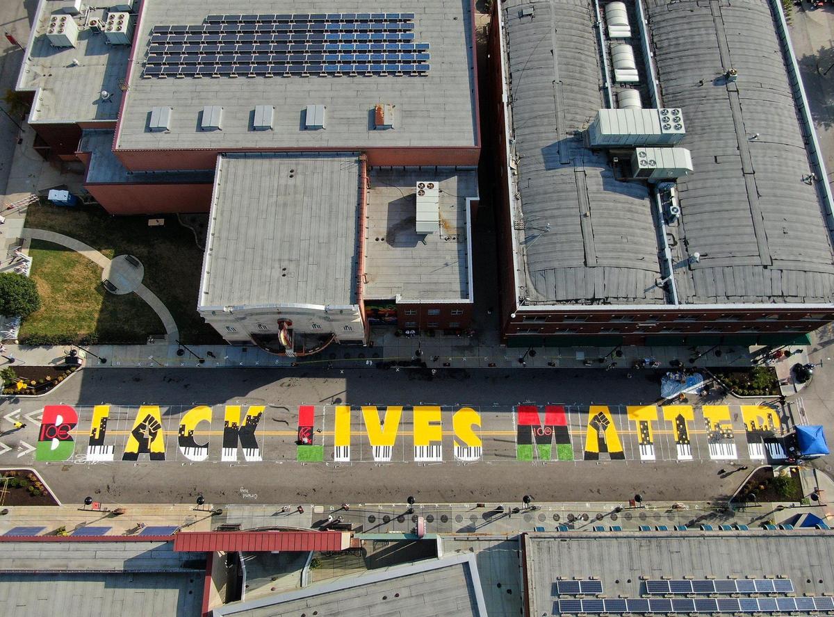 A Black Lives Matter mural now covers 18th Street near Vine in the middle of the historic Jazz District. Volunteers came together Saturday to paint six unique Black Lives Matter murals around Kansas City.