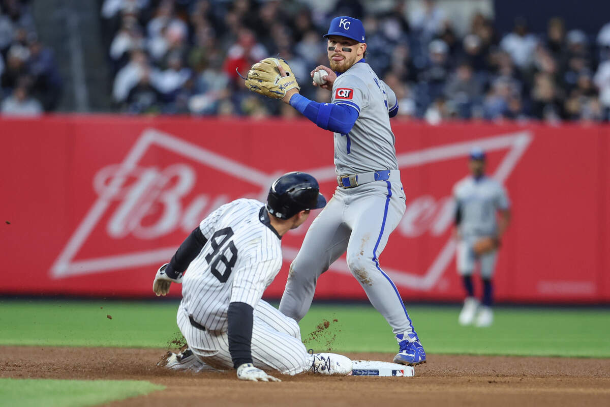 Kansas City Royals shortstop Bobby Witt Jr. attempts to throw past New York baserunner Paul Goldschmidt on a first-inning play at second base during a Wednesday, April 16, 2025 Major League Baseball game at Yankee Stadium.