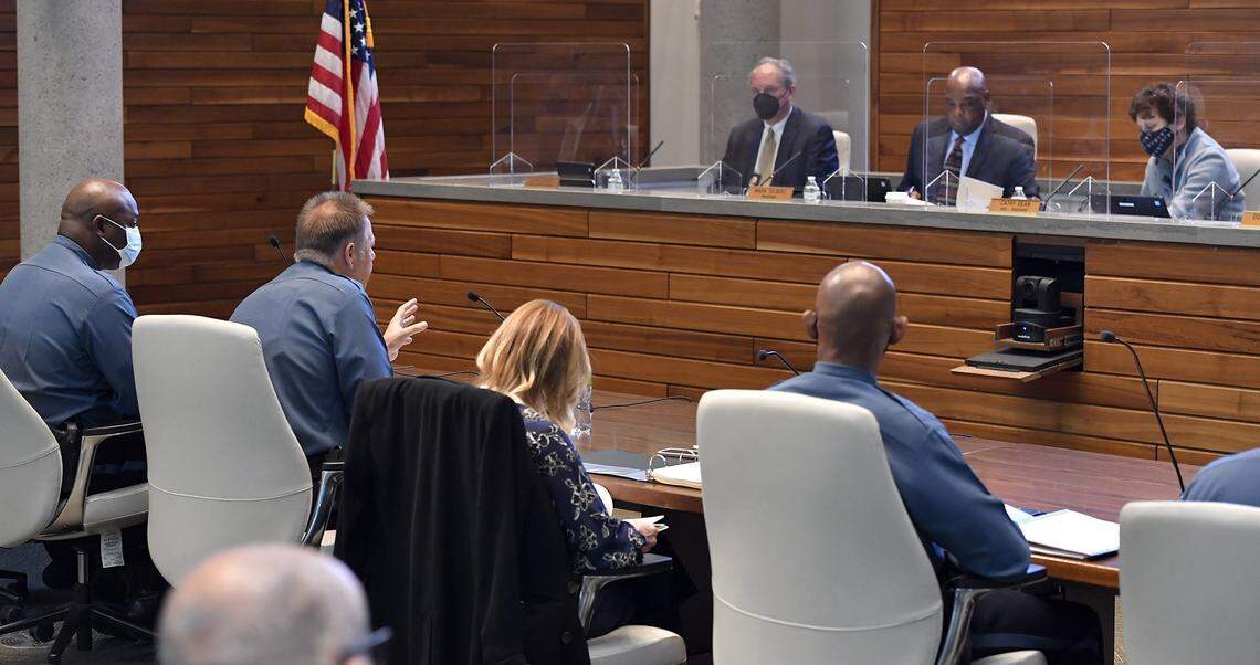 Kansas City Police Chief Rick Smith, second from left, speaks to the Board of Police Commissioners during a meeting earlier this year. In May, Smith implored residents to call their council members and suggest that portions of the $97 million in federal American Rescue Plan money that Kansas City received should be earmarked for police funding.
