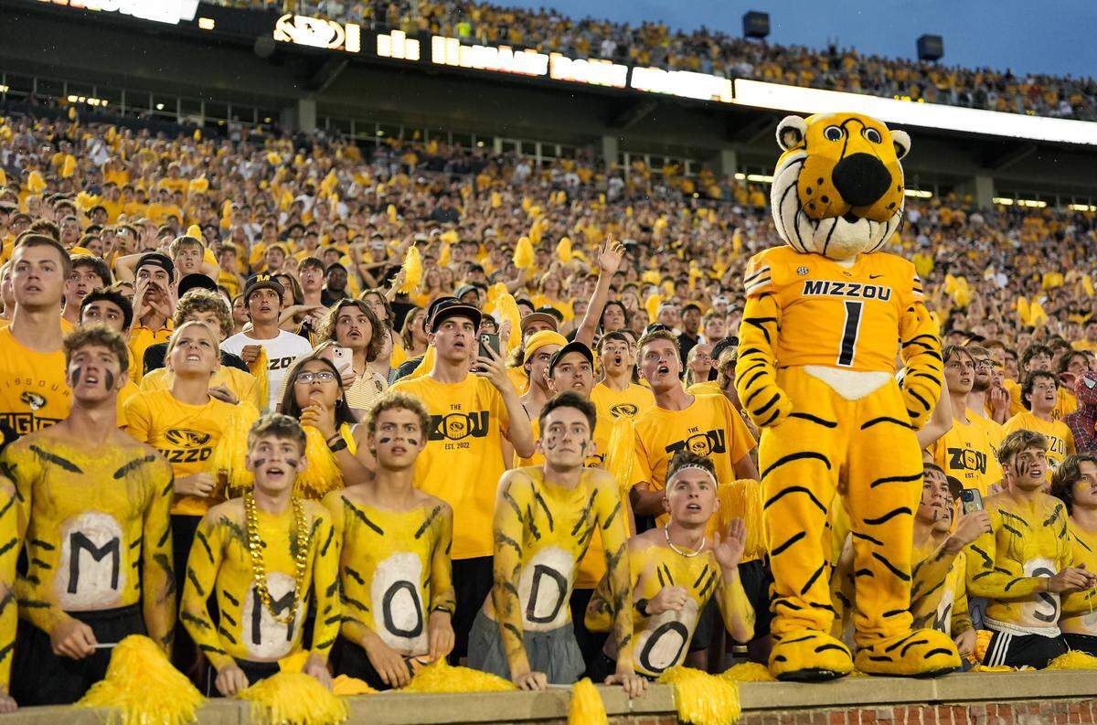 The Mizzou Tigers’ student section and Truman the mascot cheer on the football team during a 2024 college football game at Faurot Field at Memorial Stadium in Columbia, Missouri.
