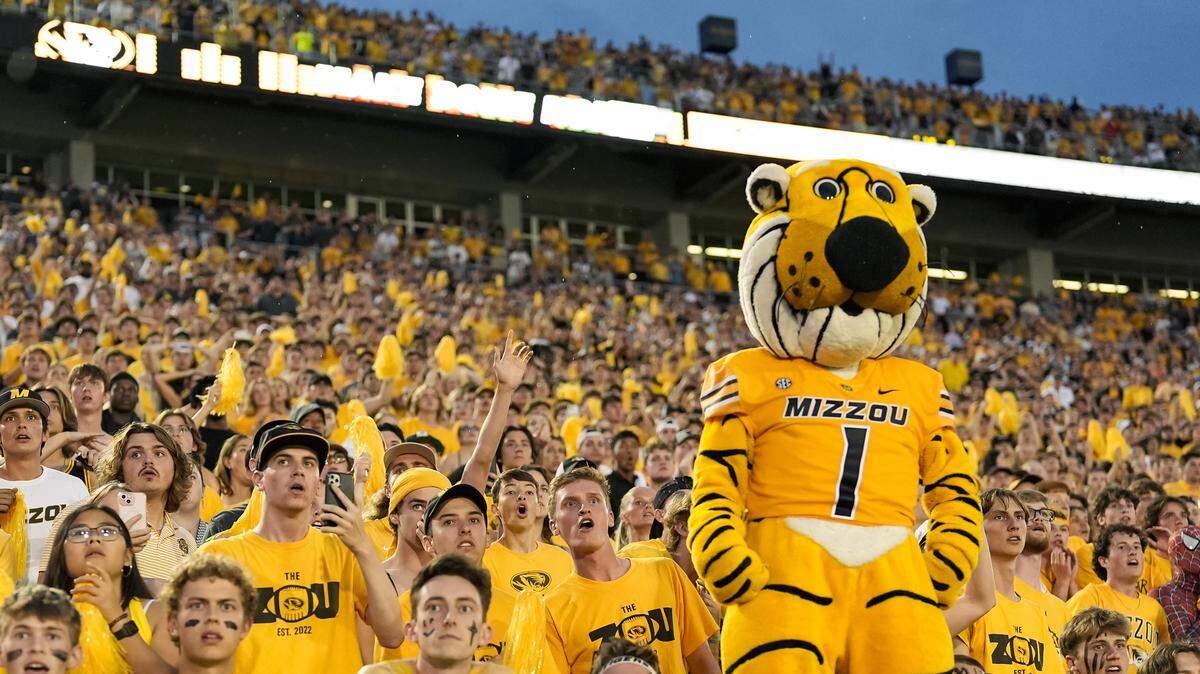 The Mizzou Tigers’ student section and Truman the mascot cheer on the football team during a 2024 college football game at Faurot Field at Memorial Stadium in Columbia, Missouri.